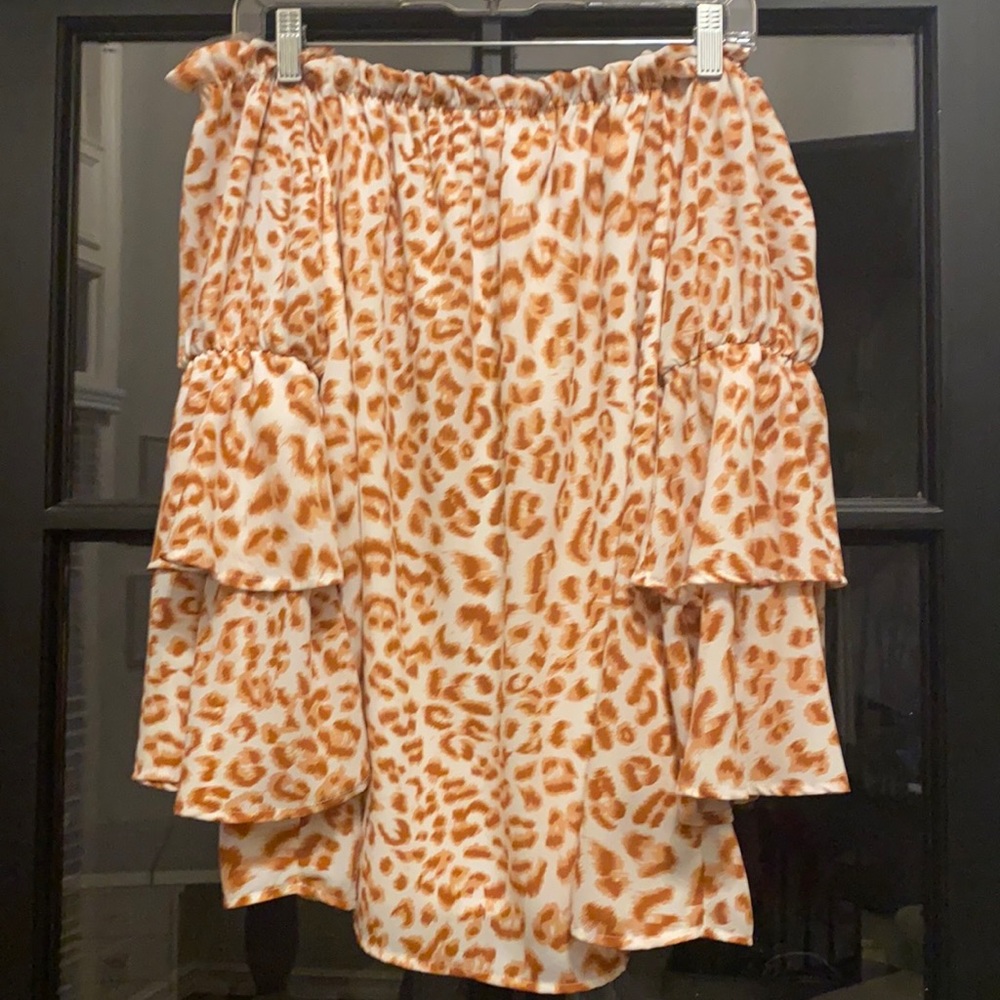 Pink/white leopard print off the shoulder long sleeve blouse.